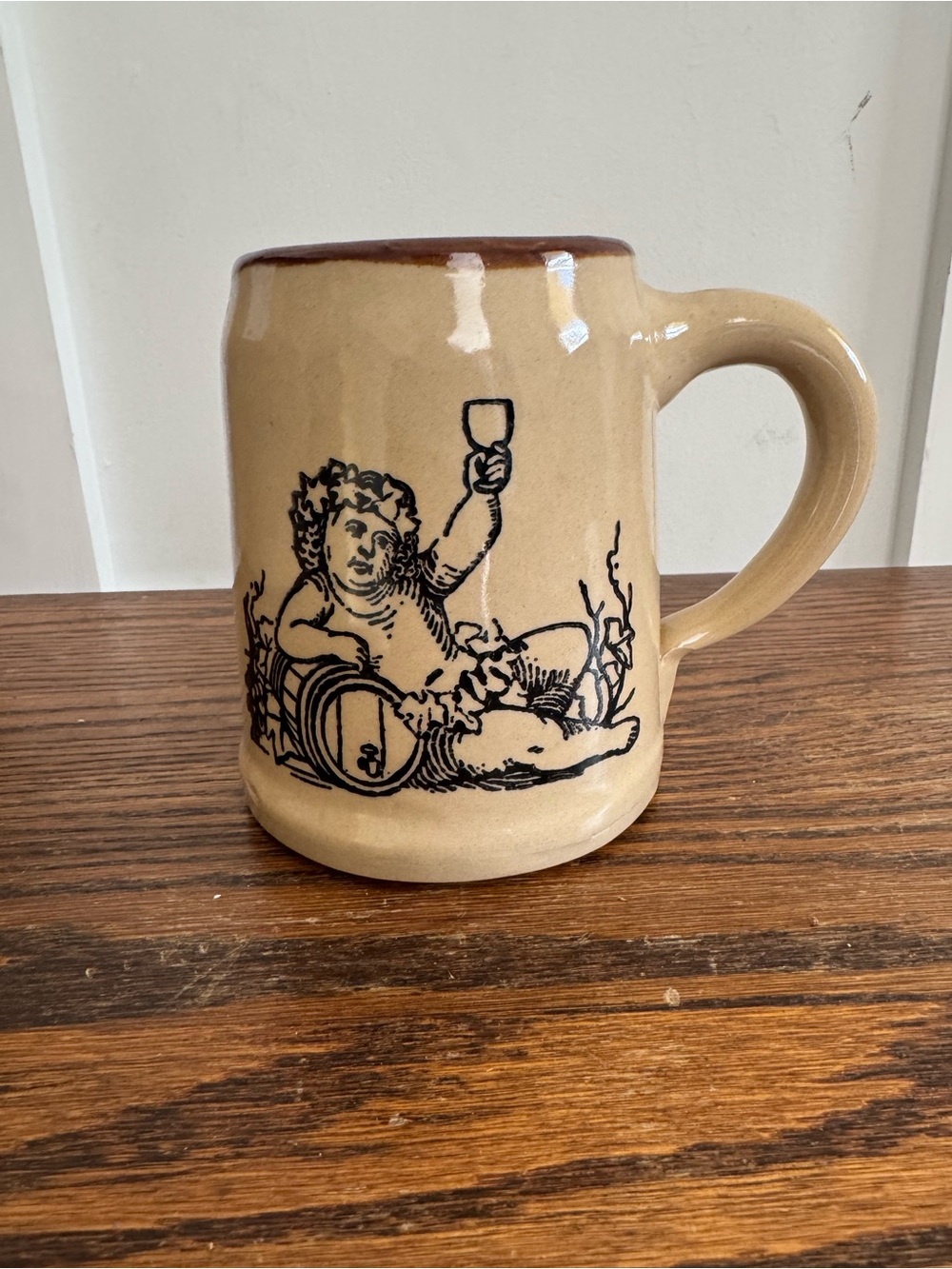 Stoneware Beige Cherub Mug with Barrel Illustration
